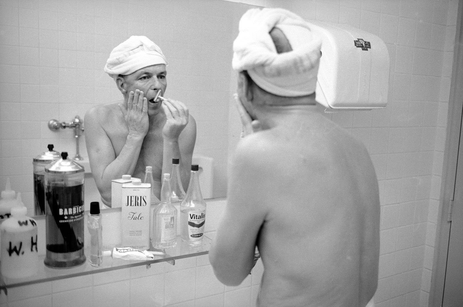 Frank Sinatra shaving with a double-edge razor