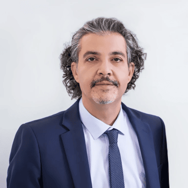 A person in a suit and tie AI-generated content may be incorrect.